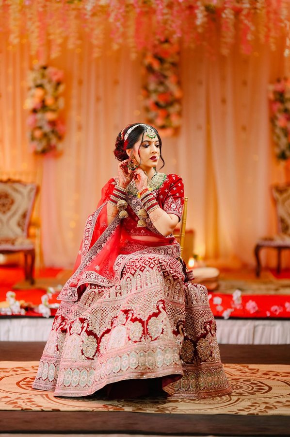 Red Lehenga — Seated Pose